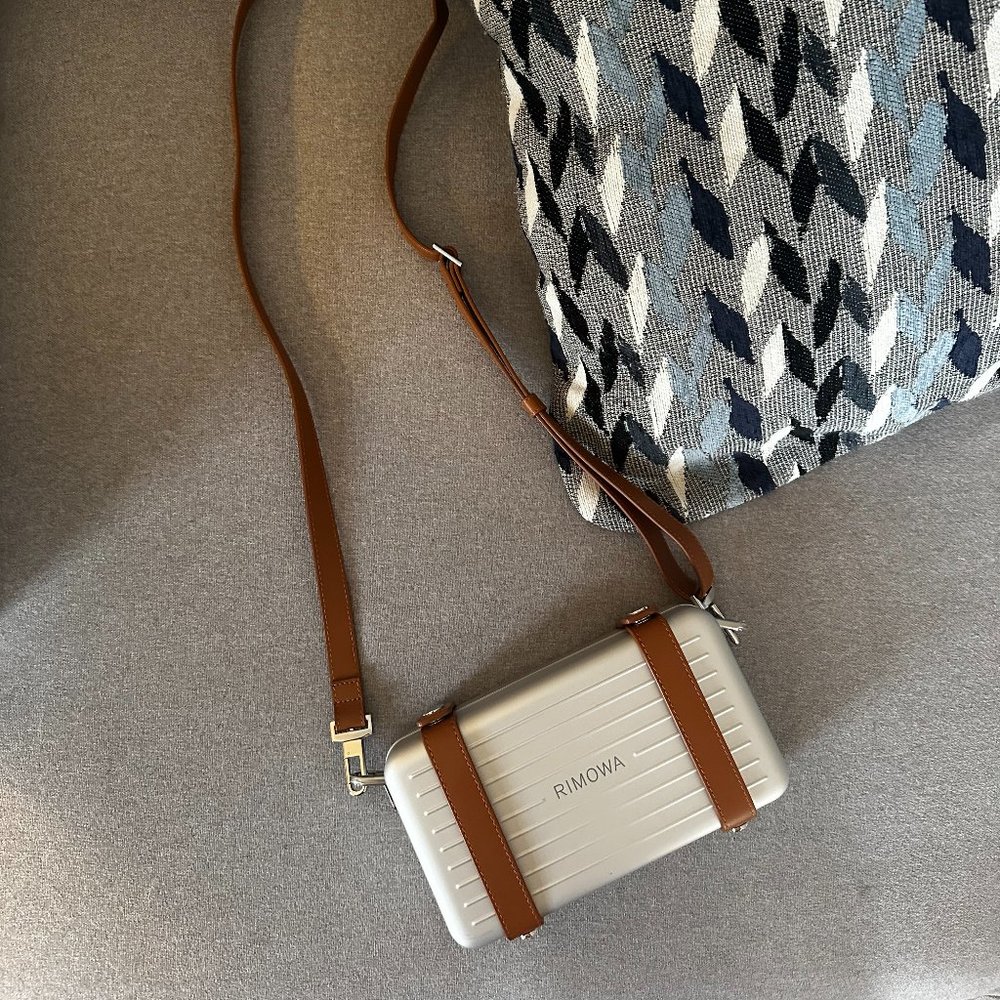 Rimowa crossbody in Aluminum / Silver with brown leather strap